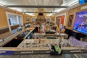 a bar with a lot of glasses on the counter at Seaport Resort and Marina in Fairhaven