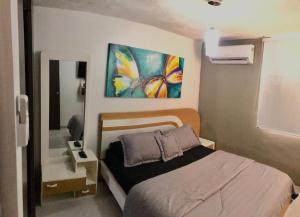 Кровать или кровати в номере Hermoso apartamento en Barranquilla +26 фотографий