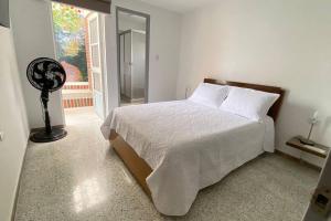 Postel nebo postele na pokoji v ubytování Apartamento Turismo en Ibagué ESMERALDA