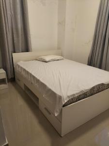 מיטה או מיטות בחדר ב-Apartamento en Santo Domingo