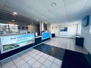 a lobby of a building with a book return service counter at Motel 6-Ventura, CA - Beach in Ventura