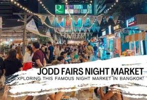a crowd of people at a market at night at 4mins walk to BTS! in Bangkok