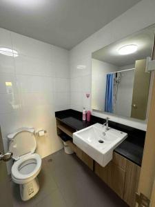 a bathroom with a toilet and a sink at 4mins walk to BTS! in Bangkok