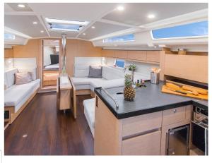 a kitchen and a living room in a boat at VOILIER 12 Mtres 3 CABINES PROCHE JO MARSEILLE in Marseille