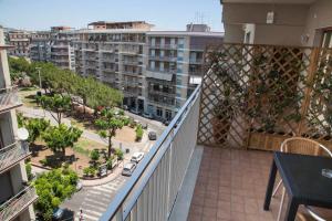 an apartment balcony with a view of a city at Etna Sea House in Catania