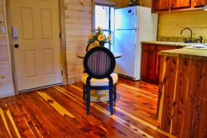 a kitchen with a chair and a refrigerator at Mountain Love Nest in Gatlinburg +15 photos