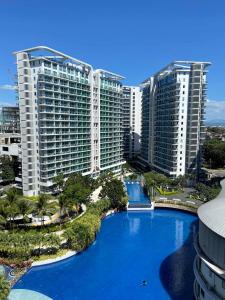 an aerial view of a resort with a large pool at La Casa Ysabela - Azure Affordable Staycation, Paranaque Metro Manila in Manila