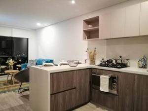 Kuchyň nebo kuchyňský kout v ubytování Apartamento moderno con balcón o terraza