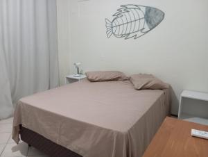 Кровать или кровати в номере Apartamento frente à Praia Dos Ingleses