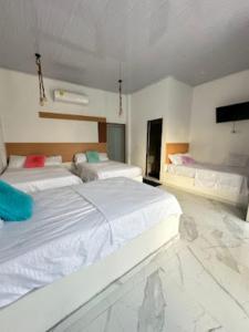 Postel nebo postele na pokoji v ubytování Hotel Casa Cafur