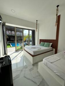 Postel nebo postele na pokoji v ubytování Hotel Casa Cafur