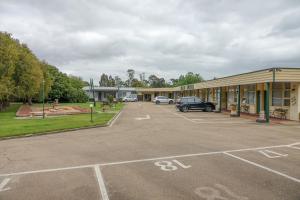 a parking lot in front of a building at Bairnsdale Main Motel in Bairnsdale