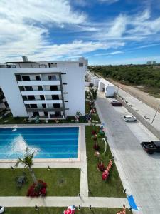 an aerial view of a building with a swimming pool at Loft Marina Cerritos in Mazatlán
