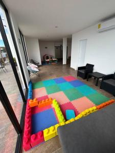 a room with a lego play room with a table at Loft Marina Cerritos in Mazatlán +11 photos