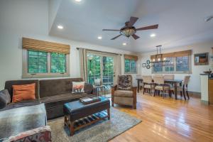 a living room with a couch and a table at Sparrow Cottage Charming Arts & Crafts Cottage in Black Mountain