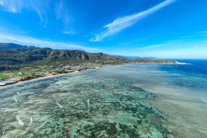 an aerial view of a beach with reefs at Chilli Fields in Phan Rang–Tháp Chàm