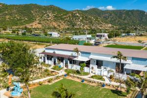 an aerial view of a resort with mountains in the background at Chilli Fields in Phan Rang