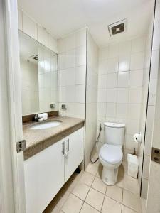 a bathroom with a toilet and a sink at Caiden's Home in Davao City