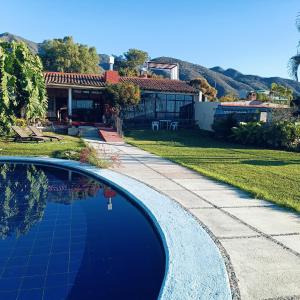 a swimming pool in front of a house at VILLA DOÑA CONCHITA in Ajijic