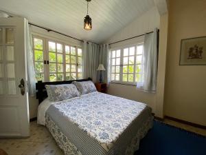 Ένα ή περισσότερα κρεβάτια σε δωμάτιο στο Pousada Villa Provence