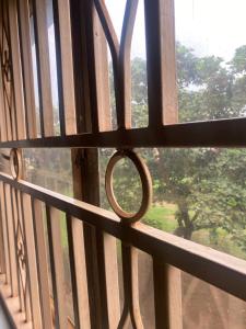 a close up of a window with a view at Pal central nest in Kampala