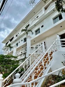 an external view of a building with a spiral staircase at Oceana Bay Coron in Coron