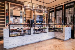 a bakery with several shelves of food at JW Marriott Marquis Hotel Shanghai Pudong in Shanghai