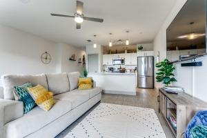 a living room with a couch and a kitchen at Beautiful Riverwalk Condo #1535 in San Antonio