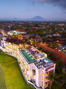 an aerial view of a building with a swimming pool at The Evitel Resort Ubud in Ubud