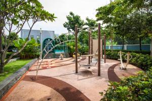 a playground in a park with a roller coaster at Suasana Bukit Ceylon by Plush in Kuala Lumpur