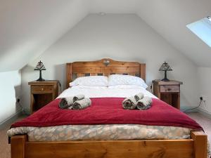 Uma cama ou camas num quarto em Blakelow Barn