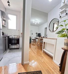 a living room with a kitchen and a dining room at Obelisco Suite in Buenos Aires