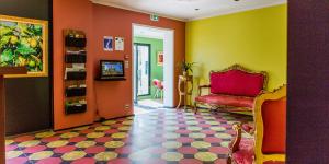 TV a/nebo společenská místnost v ubytování Rossi Hôtel