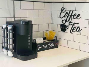 a coffee maker on a counter in a kitchen at Lady Madonna Citra Flat in Salt Lake City