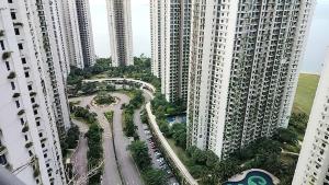 an aerial view of a park in between two tall buildings at ForesrCity私房雨露16 in Kampong Pok Kechil