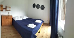 Posteľ alebo postele v izbe v ubytovaní "Dom Pod Grzybkiem"