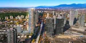 an aerial view of a city with tall buildings at Pacific Sweet Place @Metro in Burnaby