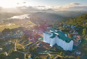 an aerial view of a city with a mountain at Araliya Red - Lean Luxury - Where you find stunning 360 panoramic view of Nuwara Eliya in Nuwara Eliya