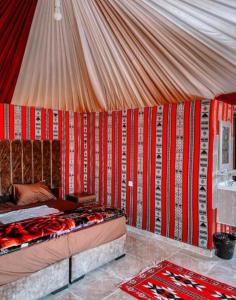 a room with a tent with a bed in it at Nasem rum in Wadi Rum