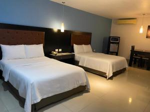 Postel nebo postele na pokoji v ubytování Autohotel Frances