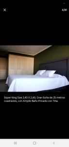 a picture of a bed in a room at Habitaciones en las condes, Cercano a metro in Santiago