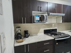 A kitchen or kitchenette at Casa Descanso de Mamá