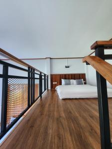 Postel nebo postele na pokoji v ubytování Suksomboonhotel