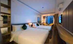 En eller flere senge i et værelse på ANNA Beach Nha Trang + 28 billeder