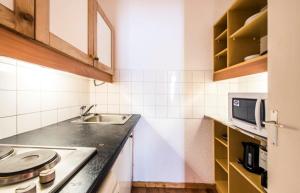 Virtuvė arba virtuvėlė apgyvendinimo įstaigoje Quartier Crève Cœur - maeva Home - 2 Pièces 5 Personnes Confort 74