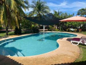 Der Swimmingpool an oder in der Nähe von Casa de Descanso en Monterrico