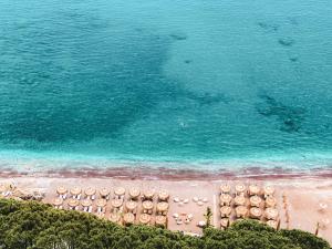 an aerial view of a beach with umbrellas and the ocean at Perios Beach House - Adults Only in Turunc
