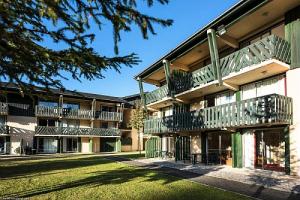 a building with balconies on the side of it at Résidence Le Sequoïa - maeva Home - Studio 3 Personnes Confort 69 in Font-Romeu