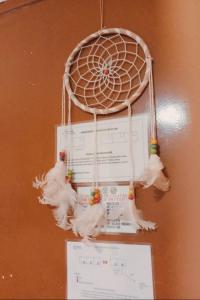 a bunch of white chickens hanging from a board at Beach Front Calatagan Apartelle in Calatagan +95 photos