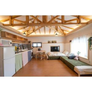 a room with a kitchen and a living room at Studio Wolyoung in Jeju +38 photos